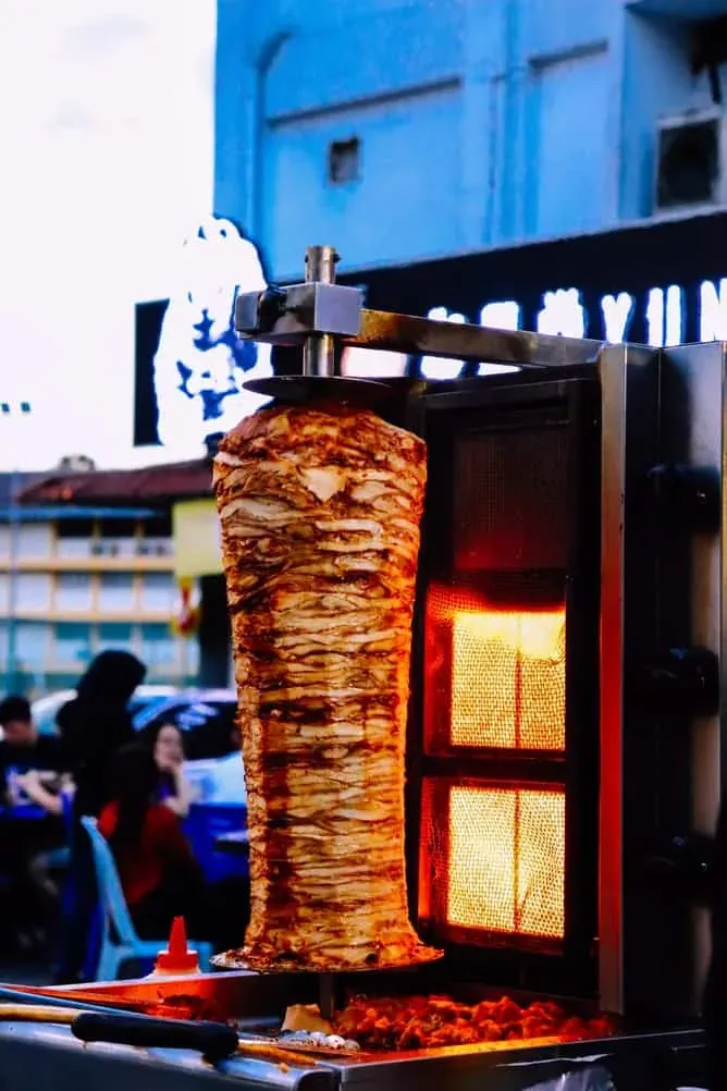 Freshly carved kebab meat ready to serve at a busy kebab place